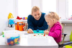 Toddler girl in child occupational therapy session