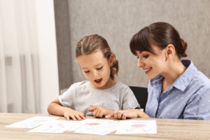 Registered Behavior Technician (RBT) working with a child during an ABA therapy session